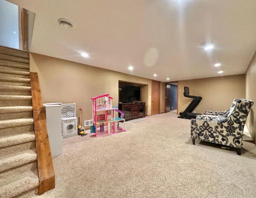 Downstairs you find a very nice sized family room. Notice how the tv space is built in to the wall.