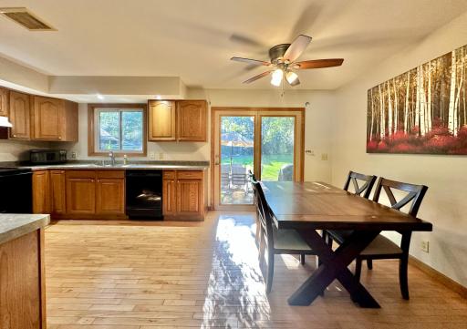 The living room transitions nicely into the dining and kitchen space which has a nice open feel. The siding patio door opens into a fantastic extension of your living space on the gorgeous patio out back.