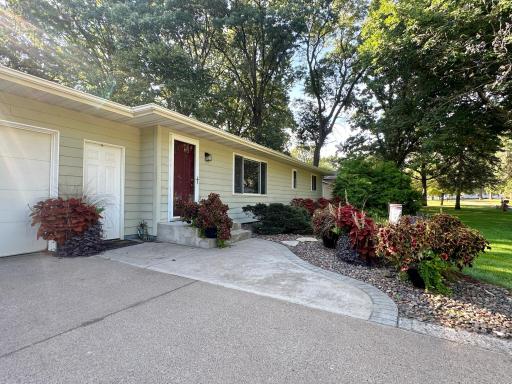 The front entry has a roomy approach with decorative brick boarder.