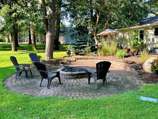 Can't say enough about the beauty of the space out back, from the hardscapes like the paver patio and fire pit to the perennials that accentuate the sitting areas.