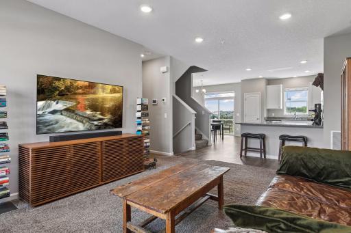 Open concept main level with living/kitchen/dining