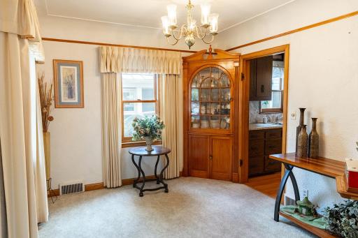 Dining room with built-in corner cabinet.