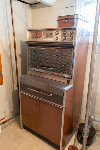 Seller intends to leave this vintage stove in the basement. It works and really comes in handy over the holidays!