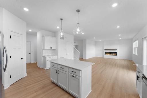 The center island features an overhang with space for counter-height seating