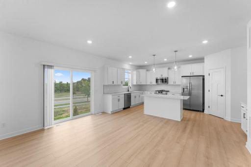 Step outside through a sliding glass door for post-meal entertainment in the backyard