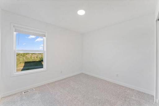All the secondary bedrooms include a practical wardrobe closet and wall-to-wall carpeting for plush comfort.