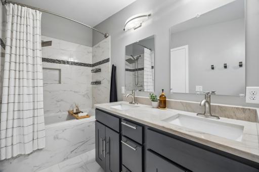 Jetted tub creating a spa-like retreat within the private ensuite.