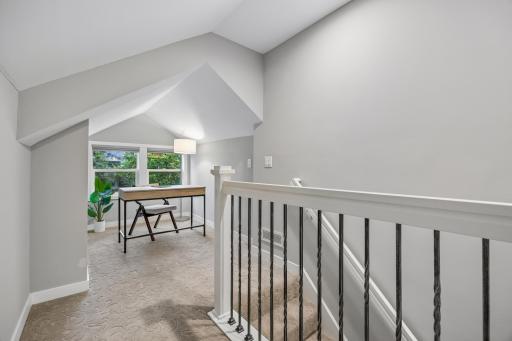 Separate sitting or work area off the primary bedroom for added flexibility.