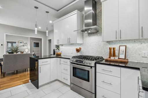 Hexagon-tiled backsplash adding texture and elegance to the kitchen.