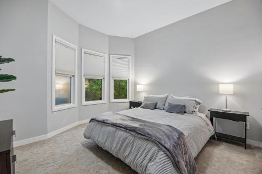Spacious main-floor bedroom with natural light and space for a bed and additional furnishings.