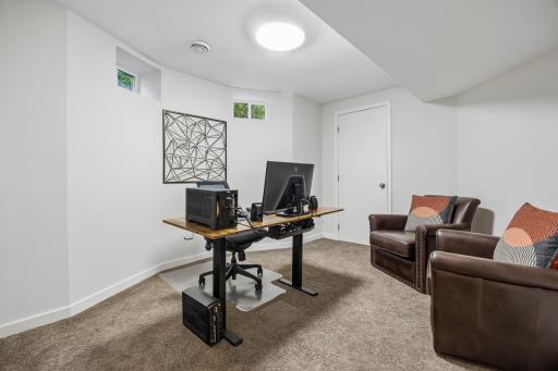 Fifth bedroom versatile space for guests, a home office, or other needs.