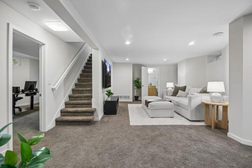 Spacious lower-level family room offering additional space to relax, entertain, or gather.