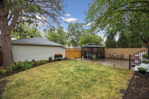Green space in the backyard, offering room to relax, play, and enjoy the yard.