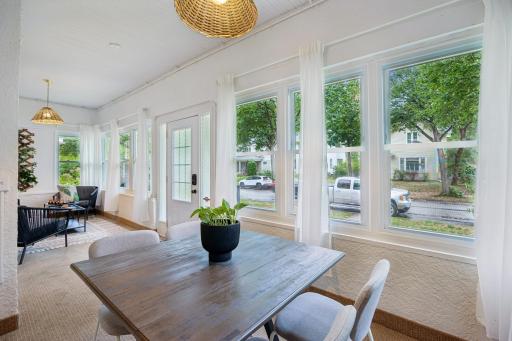 Front porch with space for both comfortable seating and a cozy spot to sit and relax.