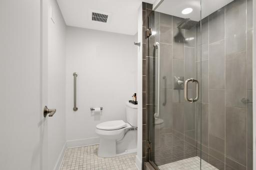 New shower and stool updated with safety bars.