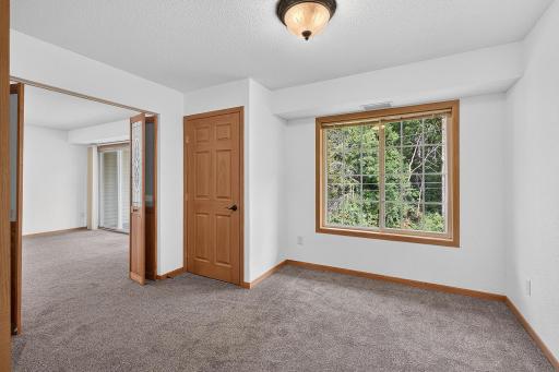 Second bedroom with french doors leading to living room.