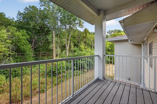 Large 12x6 balcony with composite decking. Faces wooded lot to the east.