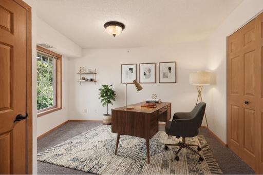 Second bedroom virtually staged as a home office.