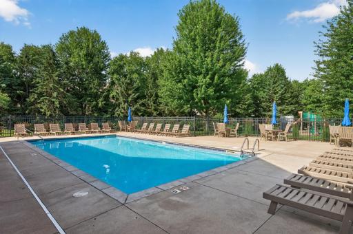 Spend your summer days relaxing by the heated community pool, complete with lounge chairs and tables for soaking up the sunshine.