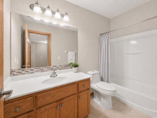 Upper level full bathroom servicing the 2nd bedroom and guest.