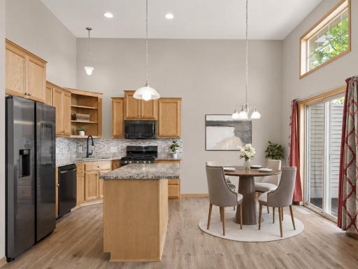 An open-concept layout seamlessly connects the kitchen, dining area, and deck that is perfect for everyday living and effortless entertaining! VIRTUAL STAGING!
