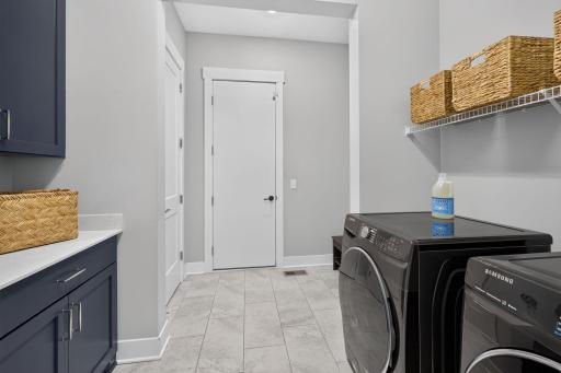 Main-level laundry and mudroom provides convenient everyday function