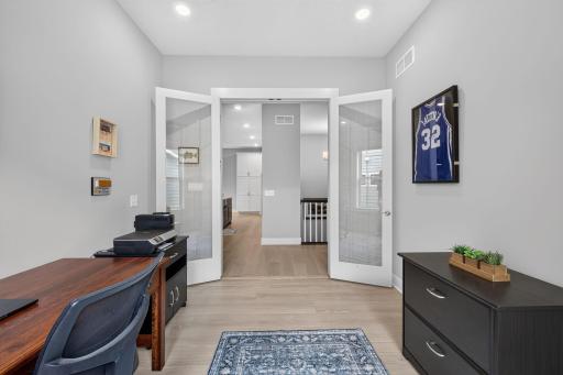 French doors add privacy while keeping the main-level office connected to the home