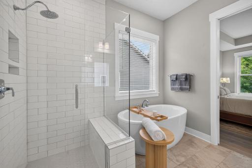Relax and recharge with a deep soaking tub and separate tiled shower
