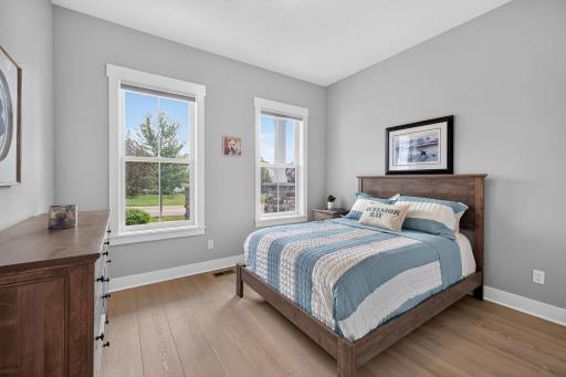 Bright secondary main floor bedroom with large windows