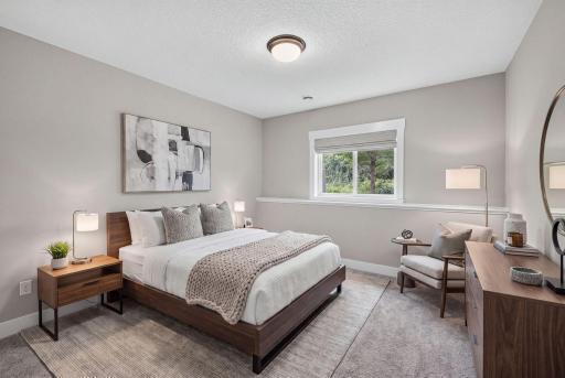Virtually staged to showcase the lower-level bedroom as a comfortable retreat for overnight guests