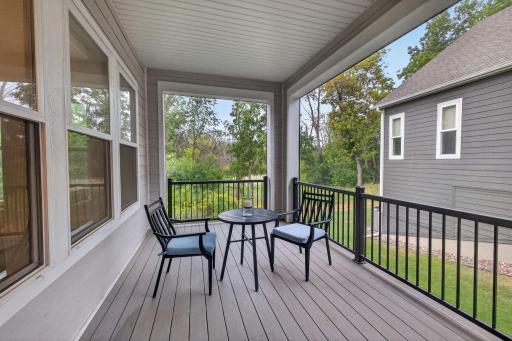 The screened porch offers a peaceful spot to relax and enjoy the outdoors
