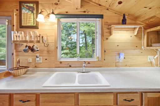 Double sink and kitchen window.