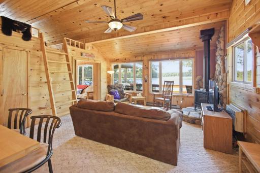 A wall of windows in the living room offers a great view of Pine lake (16'9" X 15'7").