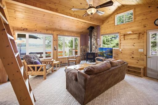 This 728 square foot cabin welcomes you inside with knotty pine walls and vaulted ceiling.