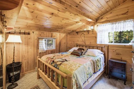 One of the two bedrooms with tons of light and vaulted ceiling.