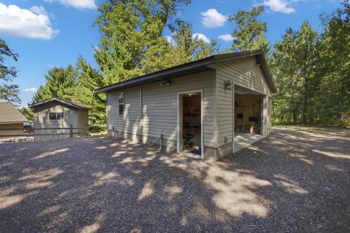 Garage has a metal roof and a handy service door.