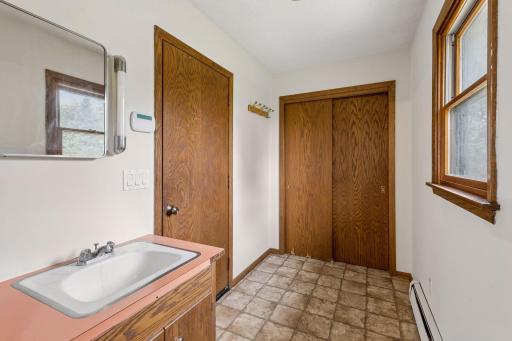 Back entry from garage for drop zone with closet. Easy to add main level laundry if so desired as water with sink for convenience is here.