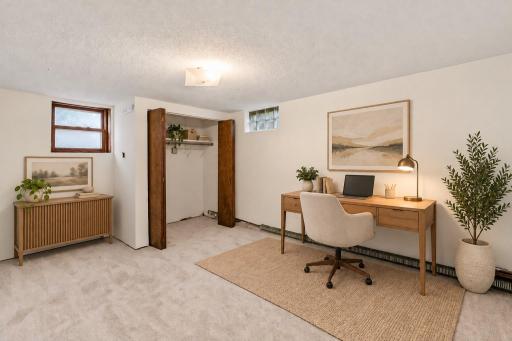Virtual staged home office or 4th bedroom option if a legal egress window is added by buyer