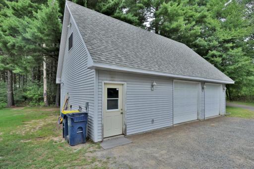 Detached 2 plus car garage with full recreation room above