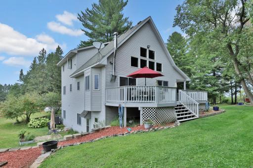 Side of home with wraparound patio and deck