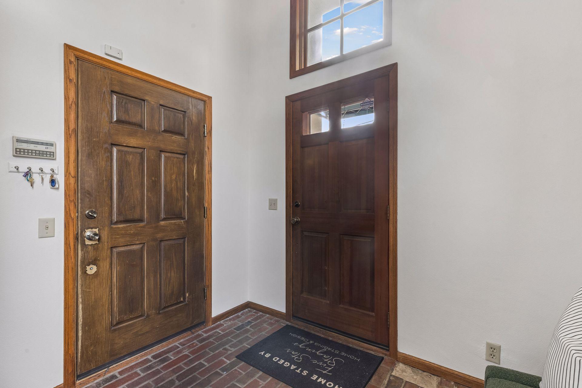 Enter directly into the foyer from the garage through the door on the left.
