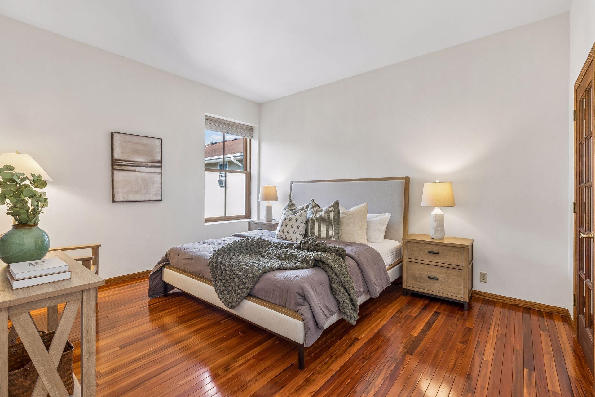Oversized bedroom on the upper level, with those gorgeous hardwood floors.