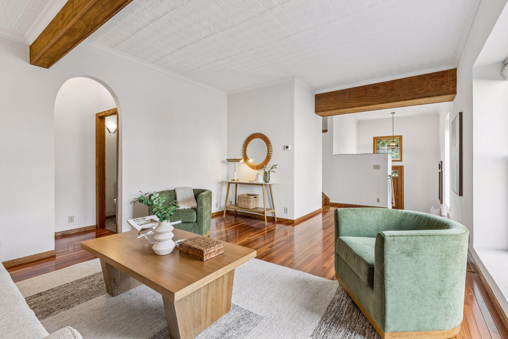 Looking back toward the entry and foyer from the living room - 3/4 bath is tucked under the arched alcove to the left.