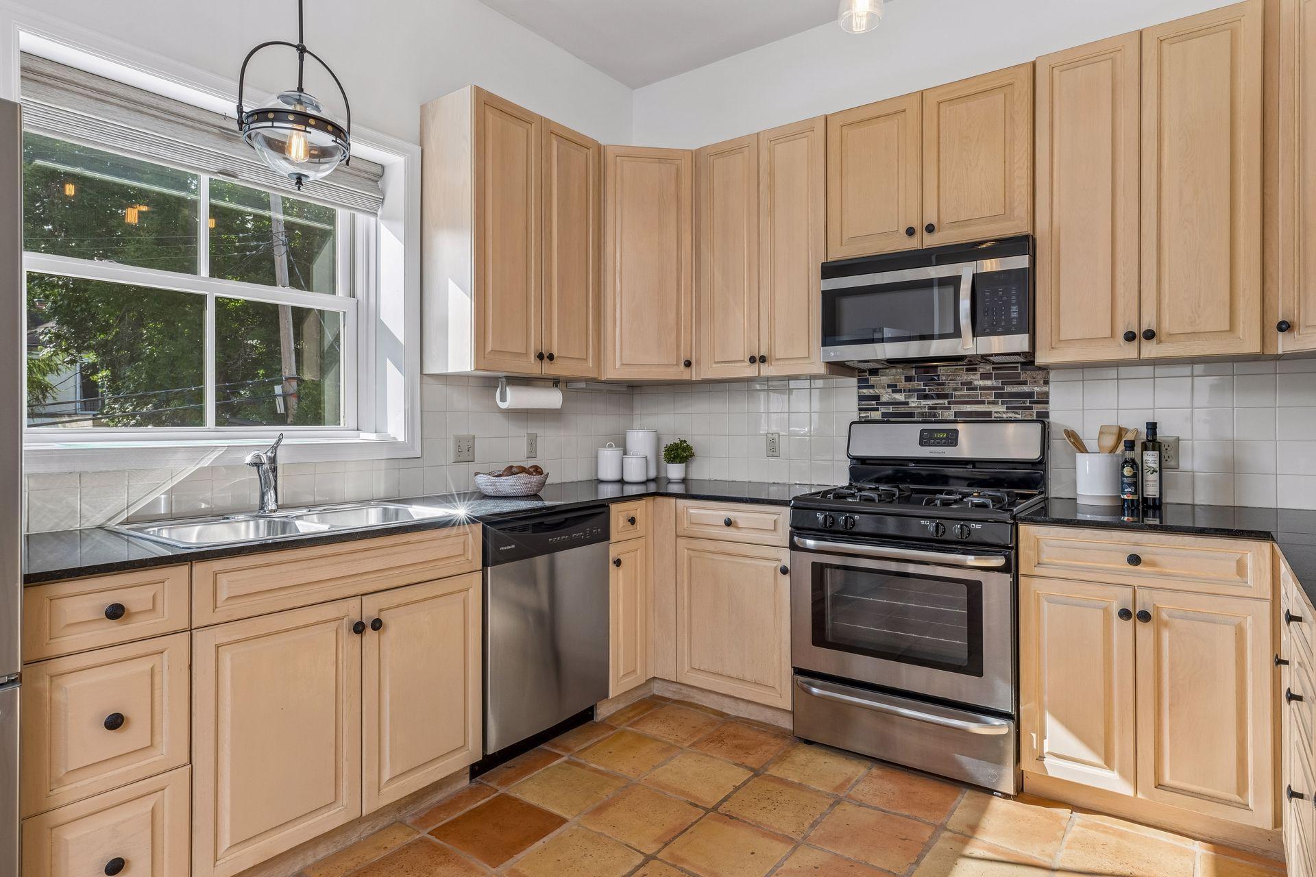 You'll love the rarity of a window over the kitchen sink that doesn't look directly into a neighbors home - so rare for this neighborhood.