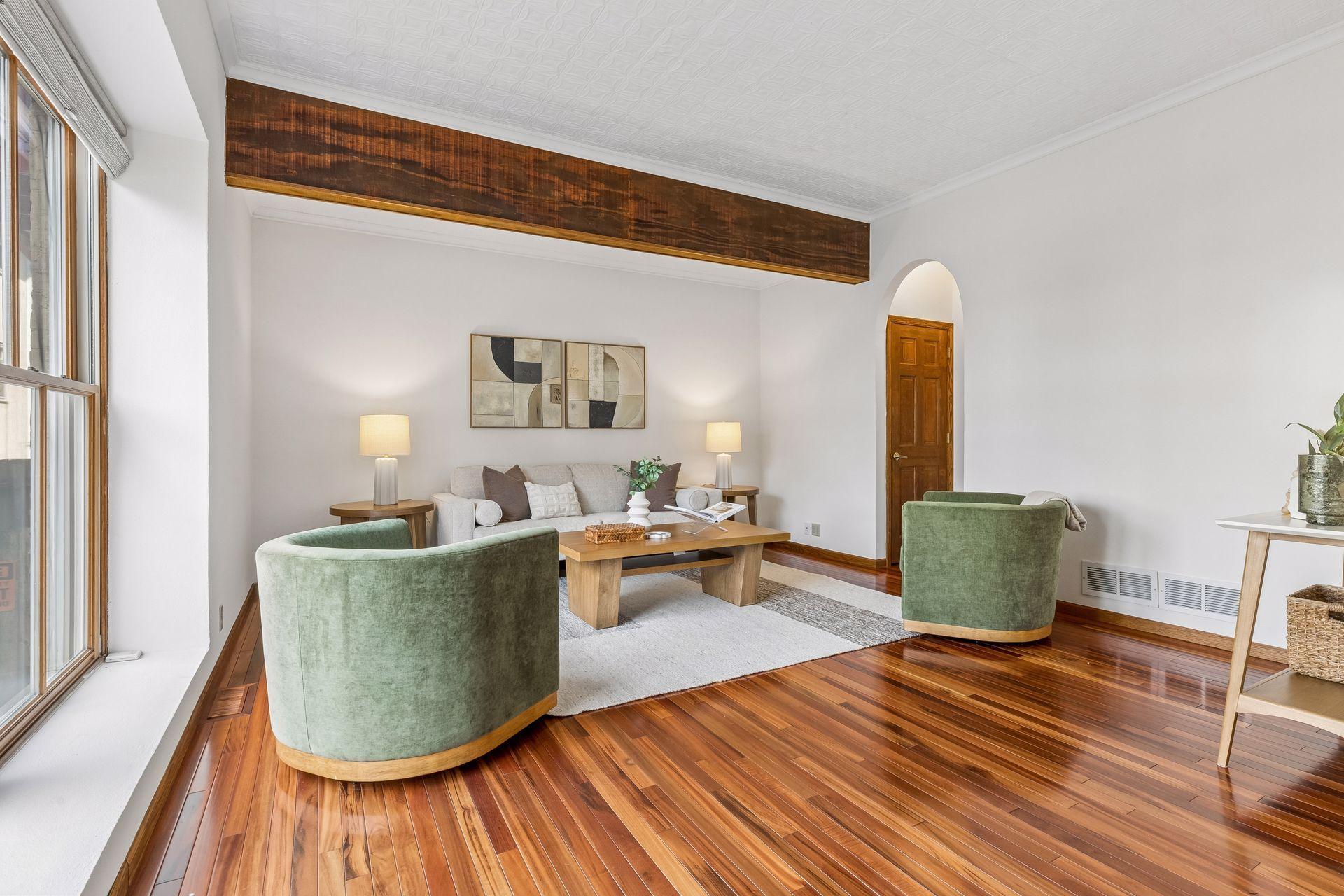 This main floor living room could easily be walled if one preferred a second bedroom.
