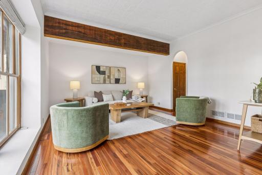 This main floor living room could easily be walled if one preferred a second bedroom.