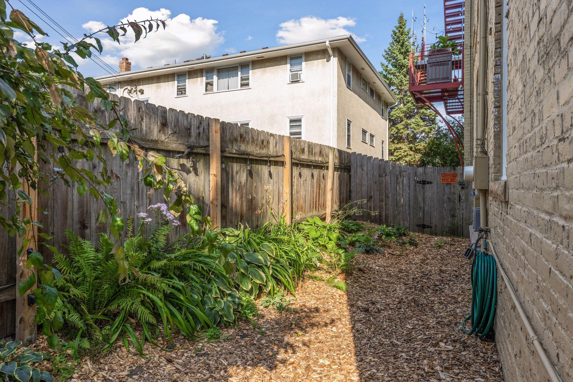 This area could allow for a small paver patio if desired, or just place a patio table directly on the flat mulched grounds.