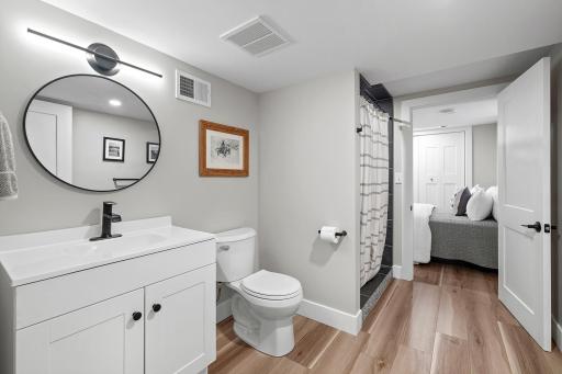 Lower level bathroom rivals the best of them with tiled walk-in shower