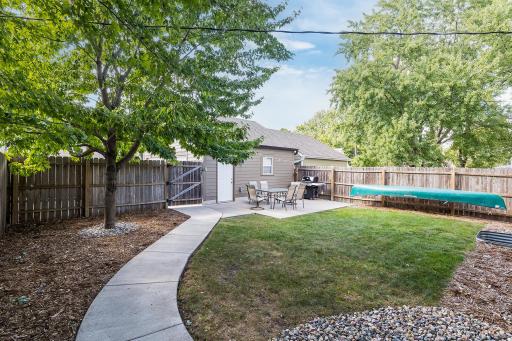 Full privacy fenced yard leads to the immaculate garage (built in 2014!)