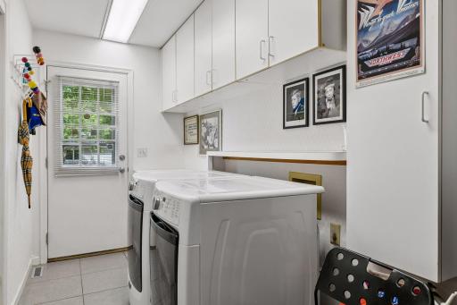 Main Floor Mud Room and Laundry walks out to 4 Car Garage!